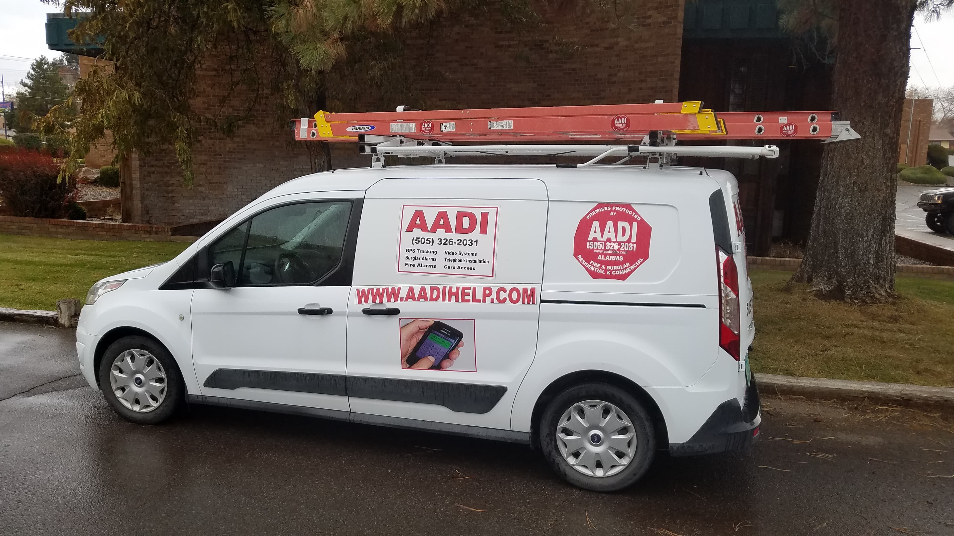 AADI service van on-site, equipped for alarm and fire system installation
